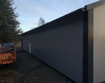 Metal shed roof covering multilayer roof and wall panel filled  with polyurethane foam 